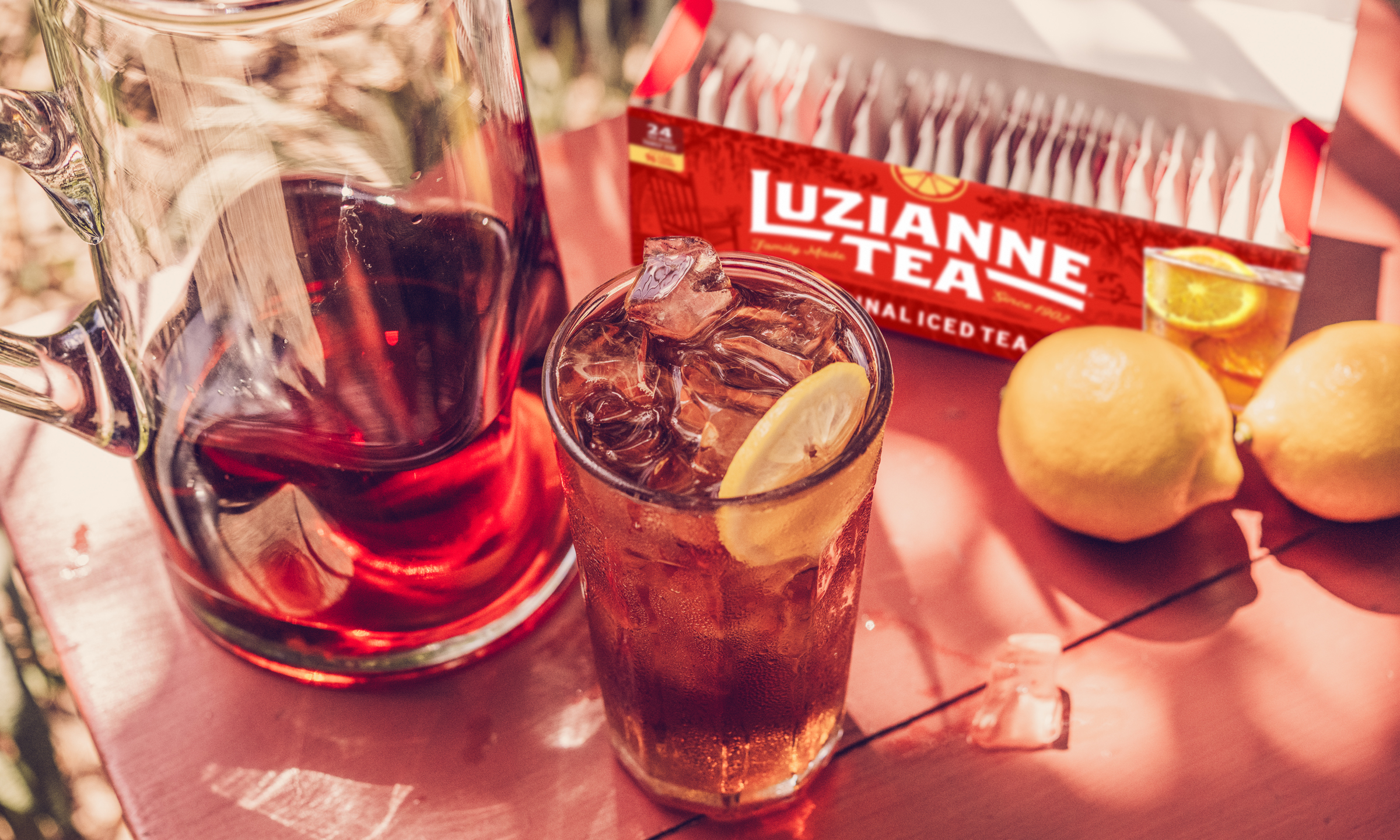 Luzianne Iced Tea in a pitcher with lemons