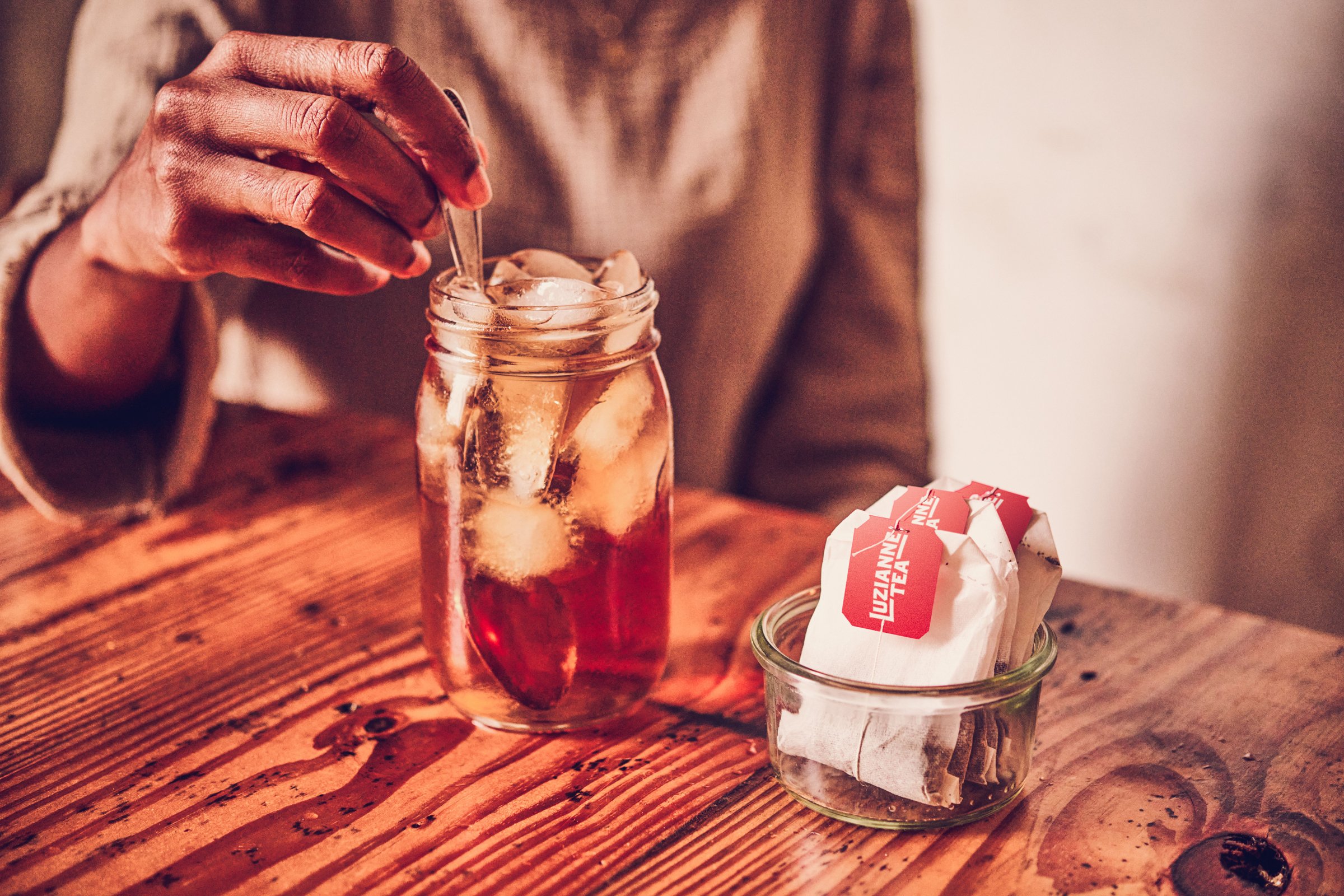 Person steeping a tea bag
