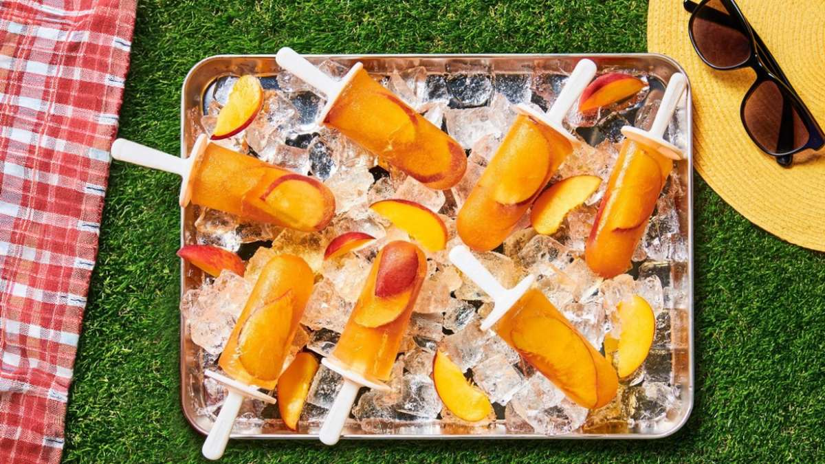 peachy sweet tea frozen pops on a tray