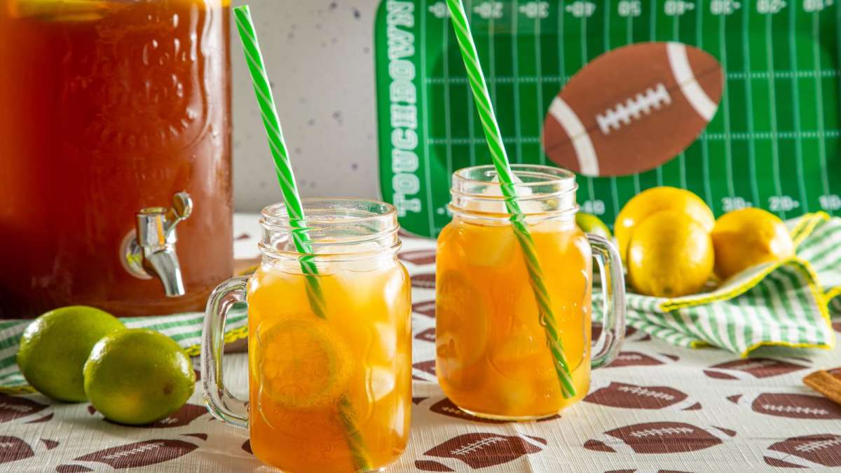 "swicy" citrus tea in glasses with ice, ready for party or tailgate