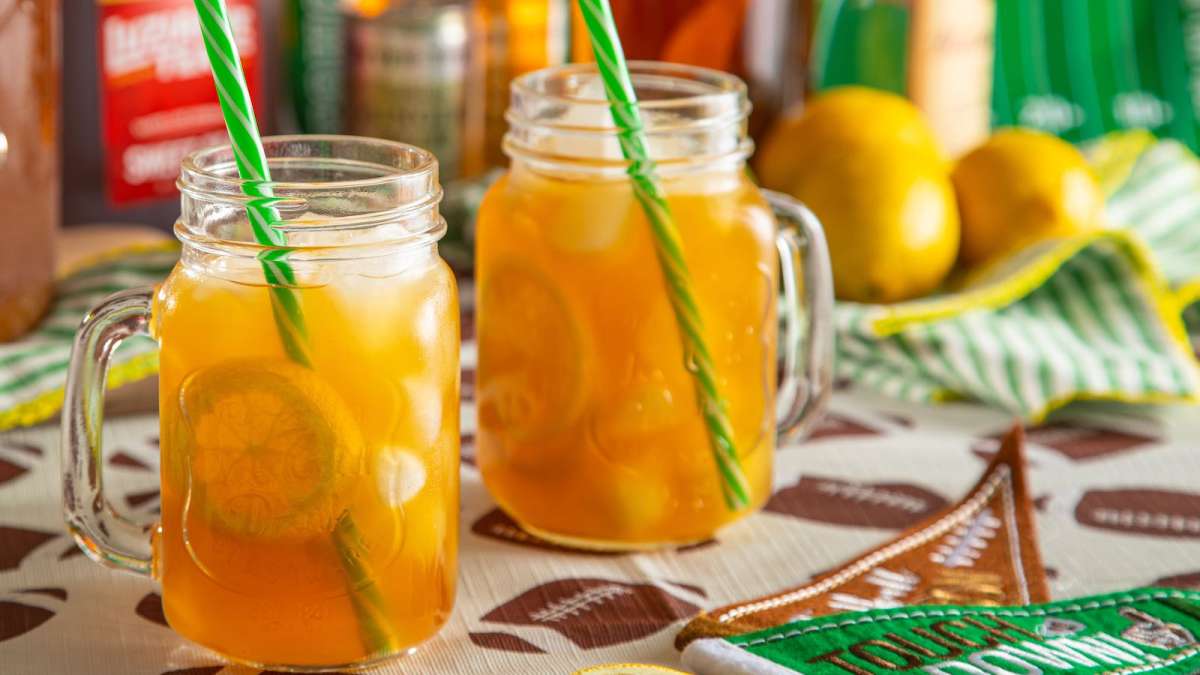 Hot Honey Tea Spritz sweet tea drink for fall, in glasses on tailgate table
